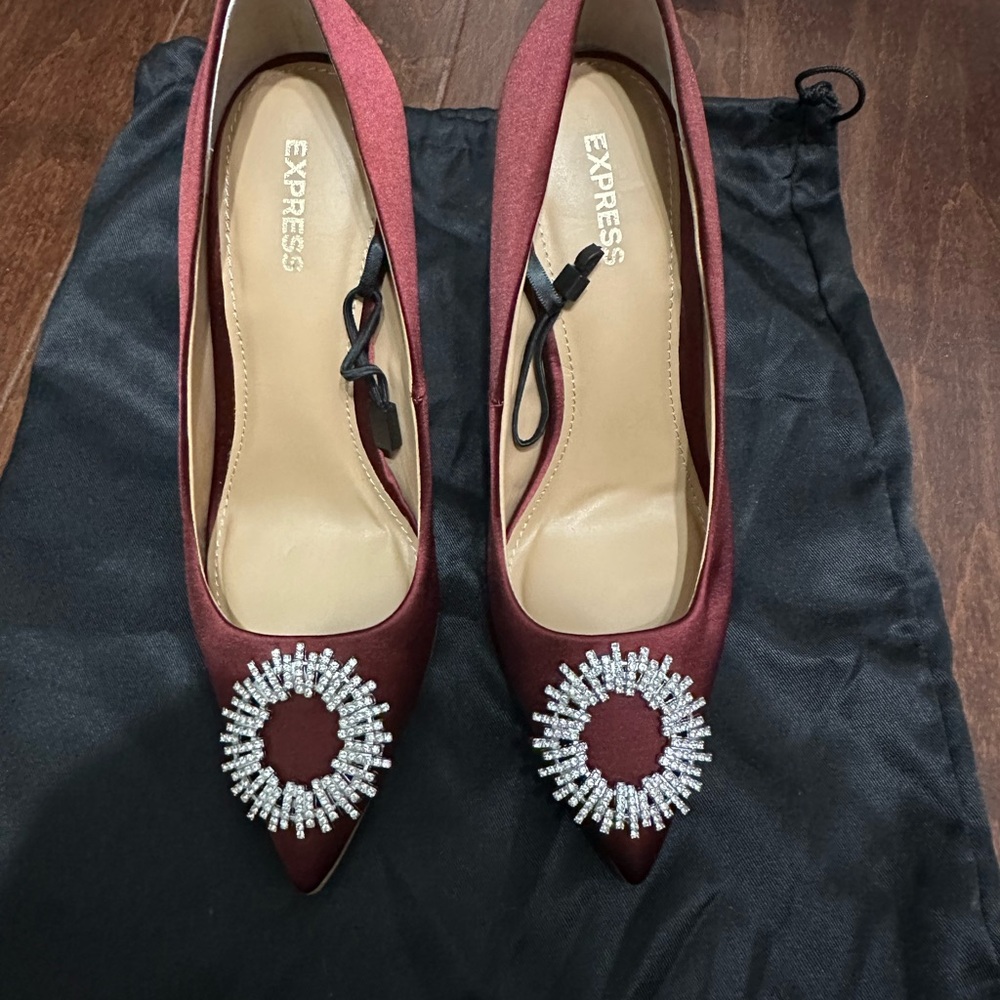 BRAND NEW, red satin pumps.